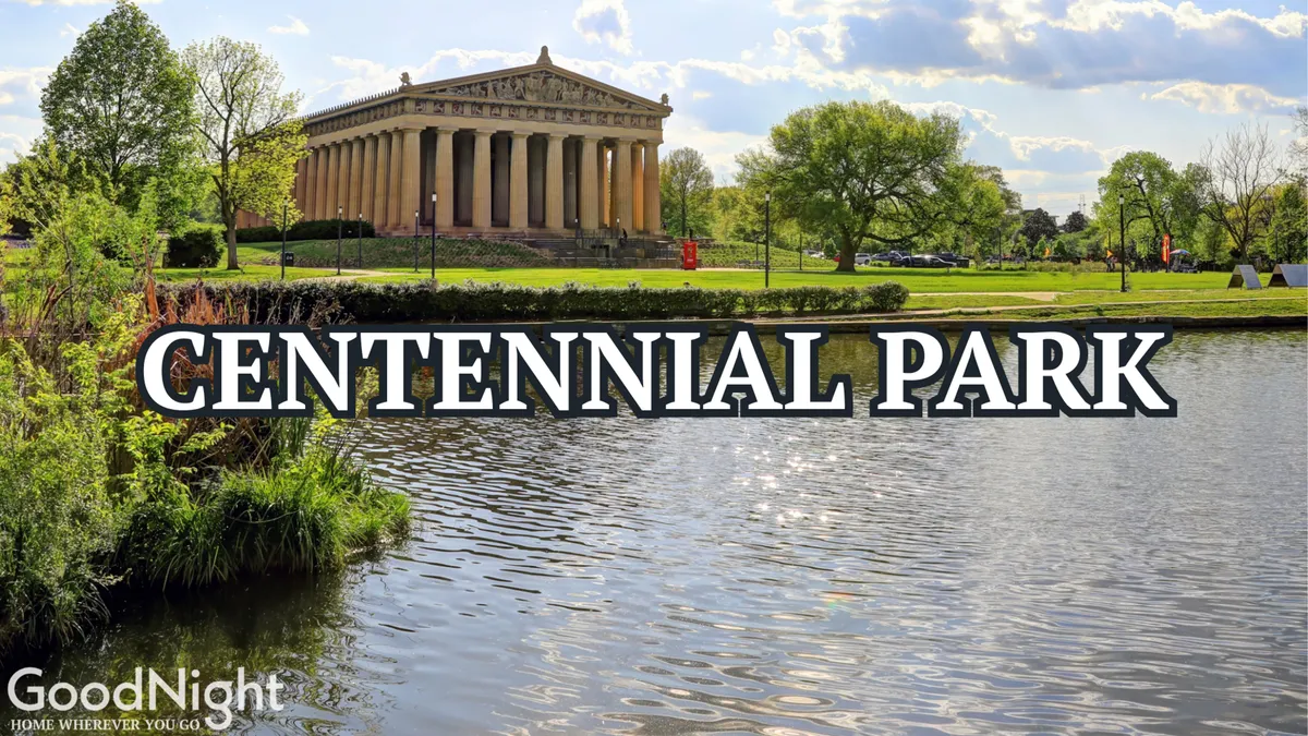 A tranquil, wide-angle shot of The Parthenon in Centennial Park, reflected on a calm water surface and framed by surrounding greenery. This perspective evokes relaxation and the beauty of outdoor experiences.